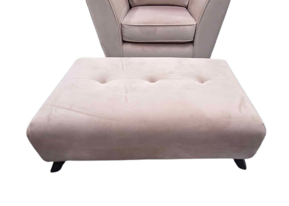 Pink armchair and ottoman on a white background