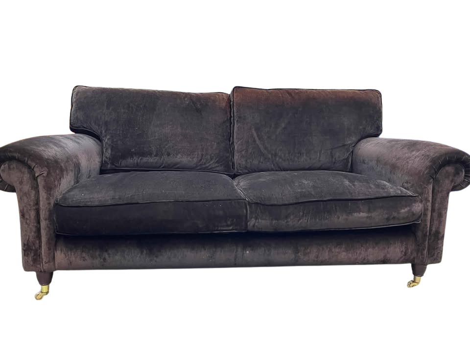 Brown velvet sofa on a white background